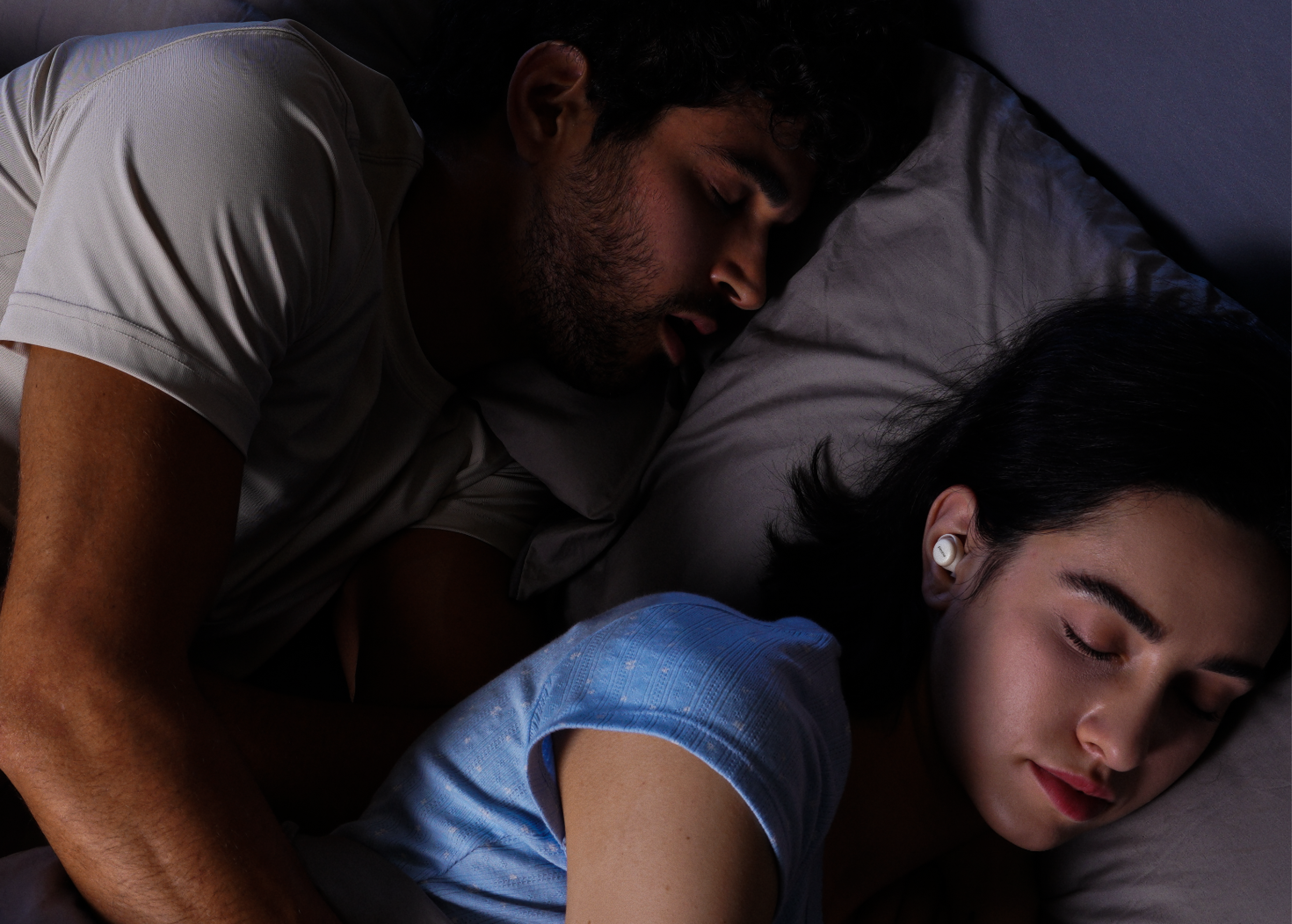 How to sleep with a snoring partner