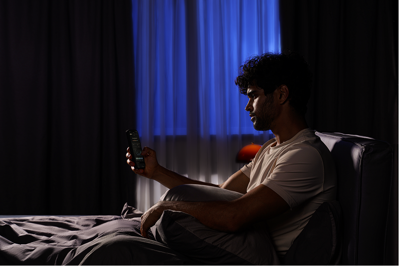 Bedroom at night using background audio to support sleep continuity