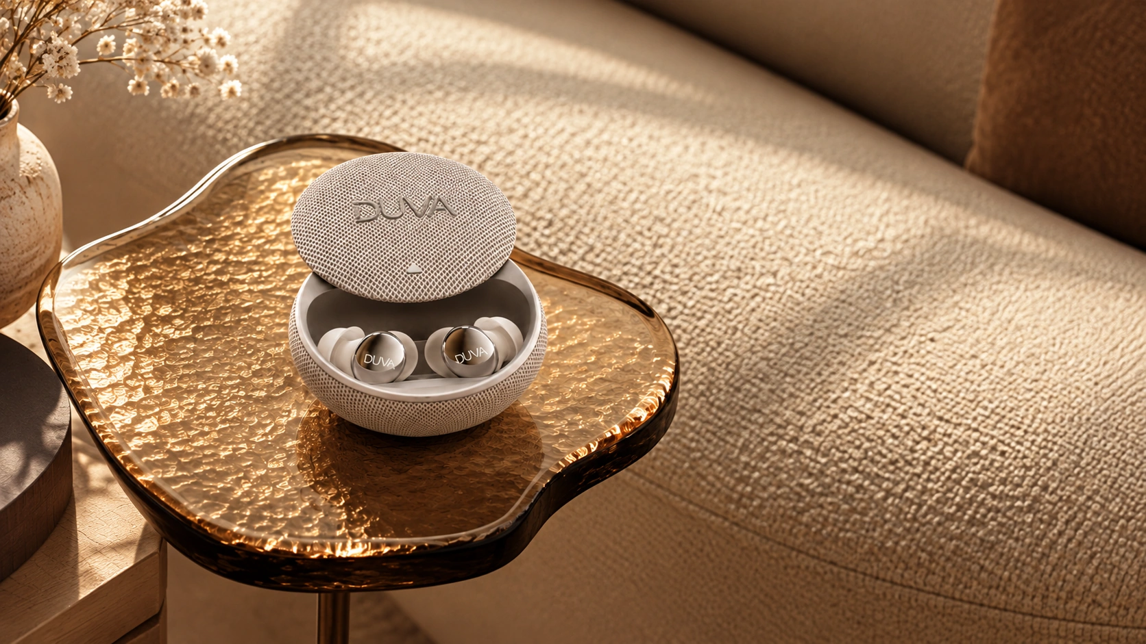 DUVA earbuds in an open charging case on an amber tray.